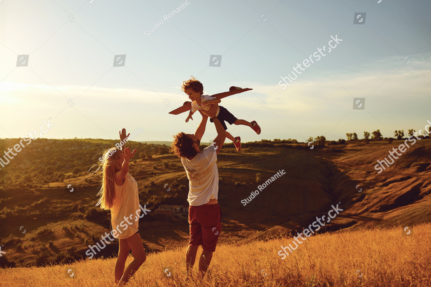 Family playing in field